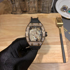 Richard Mille skeleton watch with black rubber strap and jeweled bezel