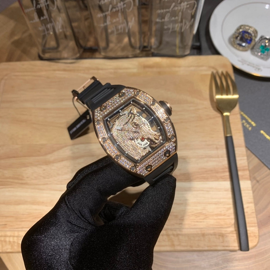 Luxury skeleton watch with black rubber strap, diamond-set case, openwork dial