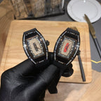 Richard Mille watch with black rubber strap, jeweled bezel, twin-tone dial detail