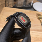 Richard Mille watch close-up on black rubber strap, blue dial with textured bezel
