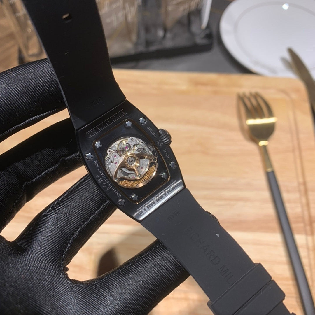 Richard Mille watch with black rubber strap, skeleton-style dial and metal accents