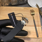 Richard Mille watch with black rubber strap and hang tag, metal clasp visible