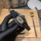 Richard Mille watch on black rubber strap, jeweled bezel and red accent dial
