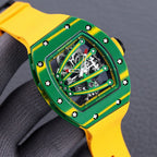 Richard Mille skeleton watch with green case, yellow accents, exposed gears, yellow strap