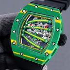 Richard Mille skeleton watch with green case, yellow bezel, black strap and side crown