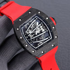 Richard Mille watch with skeleton dial, dark case, red rubber strap and red accents