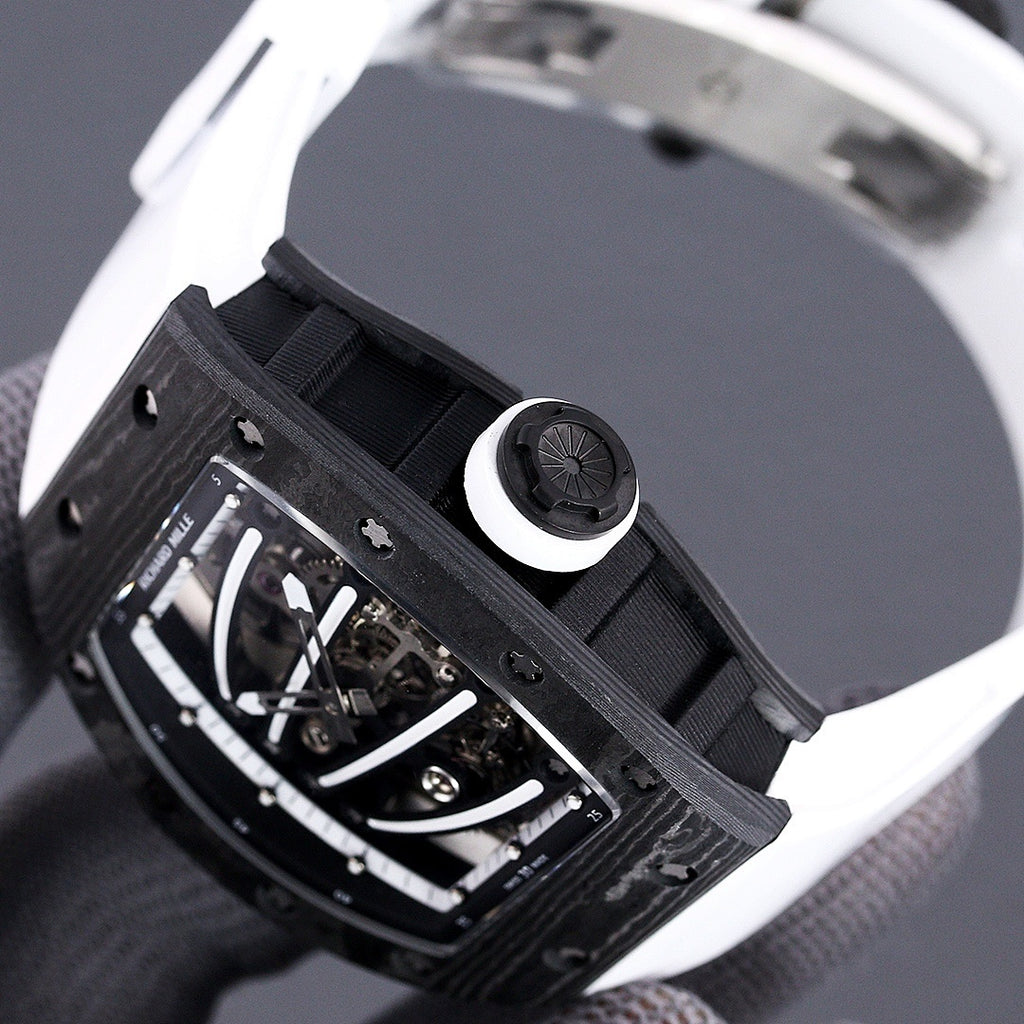 Richard Mille watch side view with crown, dark case, exposed movement, black strap