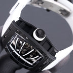 Richard Mille watch side view with crown, dark case, exposed movement, black strap