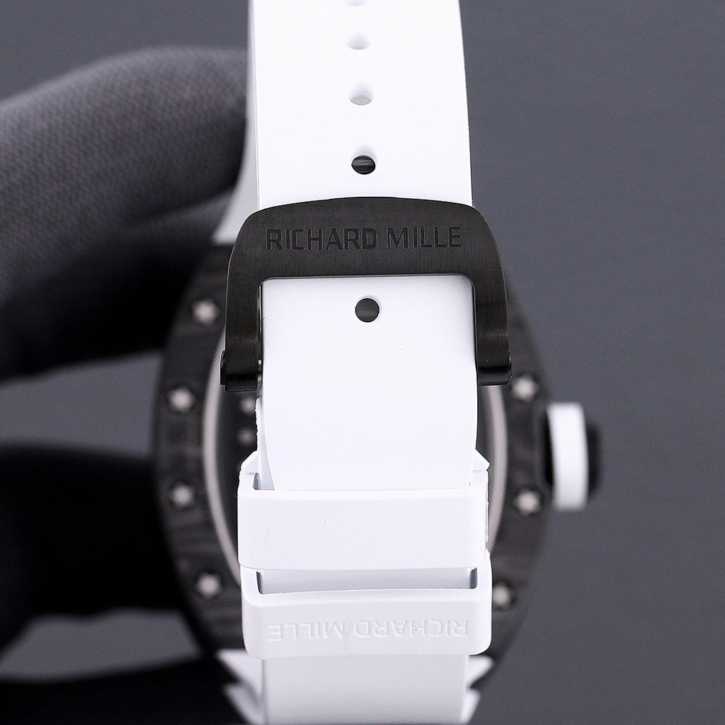 Richard Mille watch back view, white strap with buckle and clasp, dark case