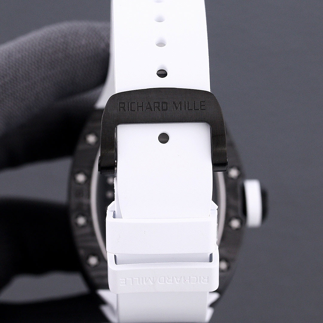 Richard Mille watch back view, white strap with buckle and clasp, dark case