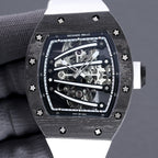 Richard Mille watch front view, skeleton dial and dark bezel, white rubber strap