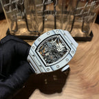 Luxury wristwatch showing skeleton movement through a clear dial window