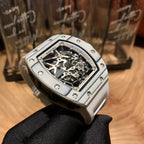 Luxury wristwatch angled view with skeleton dial and silver bezel