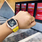 Richard Mille watch on wrist with blue dial and yellow silicone strap