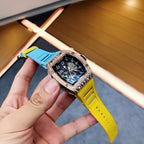 Richard Mille watch angled view with blue dial, rose-gold case, yellow silicone strap