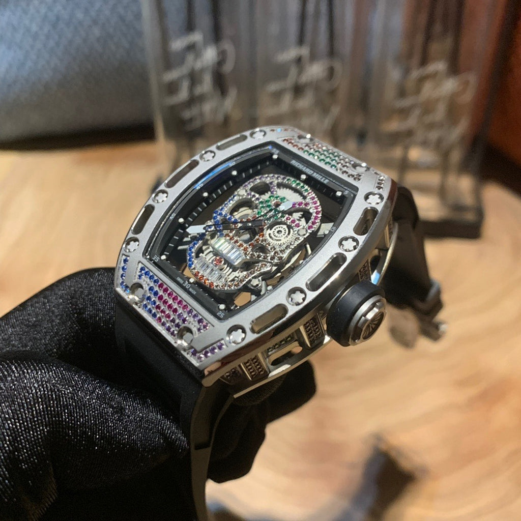 Skeleton wristwatch with jeweled bezel and crown side, black strap