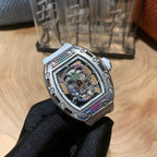 Luxury wristwatch with light silver case, jeweled open dial, and dark patterned strap