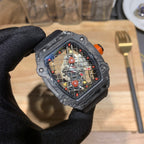 Richard Mille watch close-up with black case, orange crown, and colorful skeleton dial