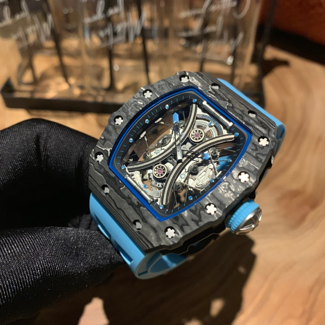 Richard Mille watch close-up of skeleton dial, black case with blue bezel and blue strap