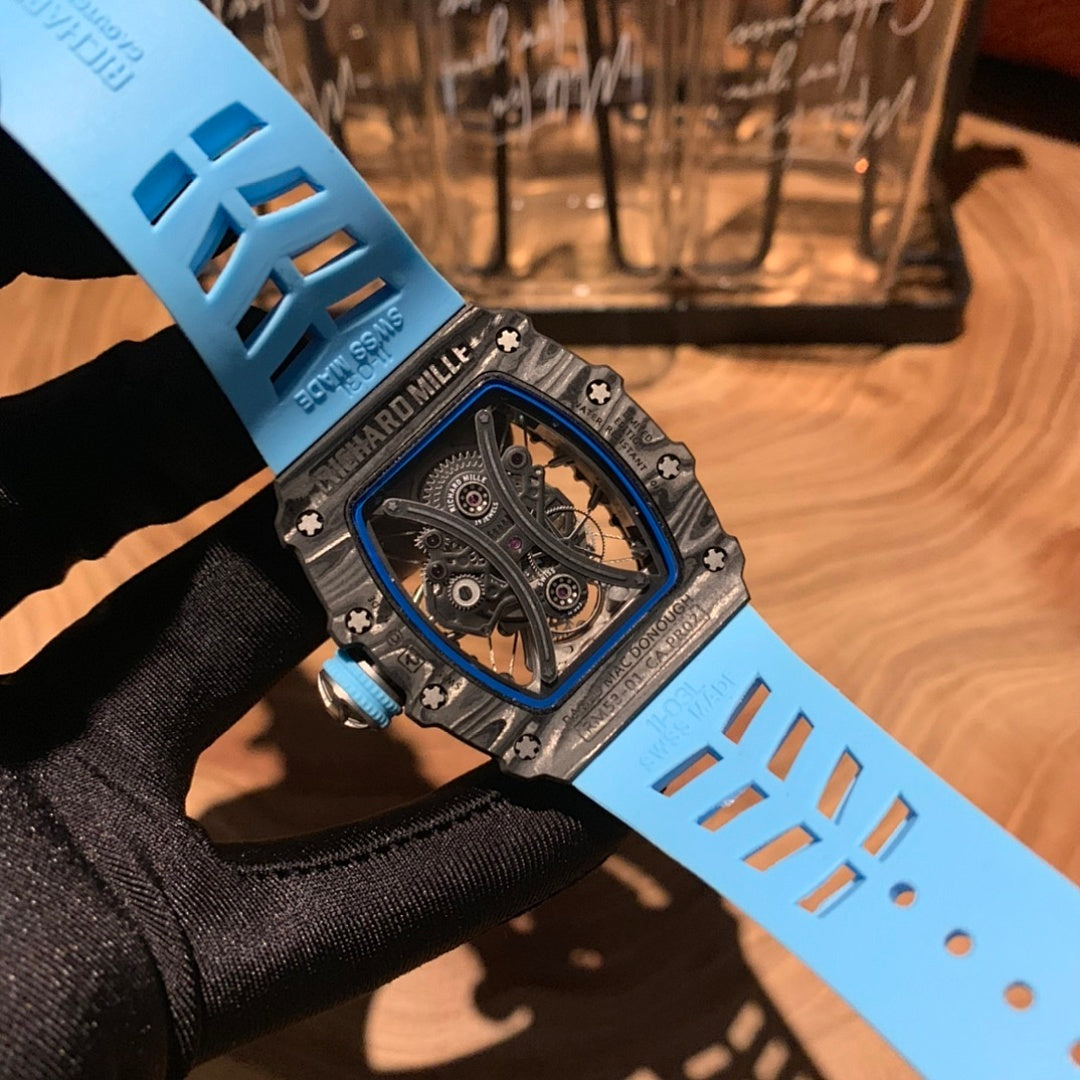 Richard Mille watch on bright blue rubber strap with textured pattern and metal clasp