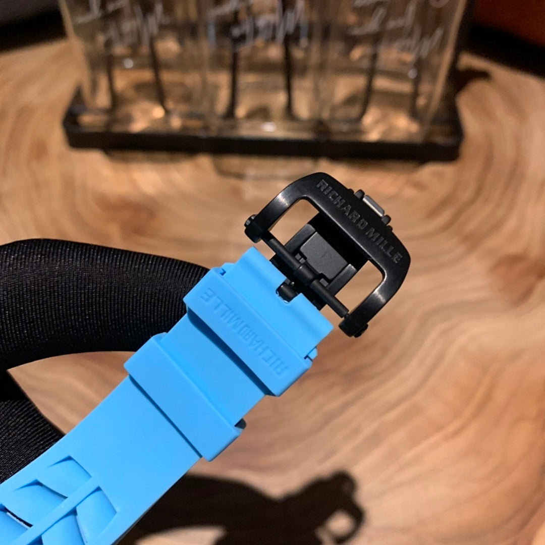 Richard Mille watch strap end with black tang buckle and blue rubber strap