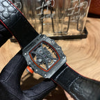 Richard Mille watch with black leather strap, square skeleton dial, red bezel outline, black case