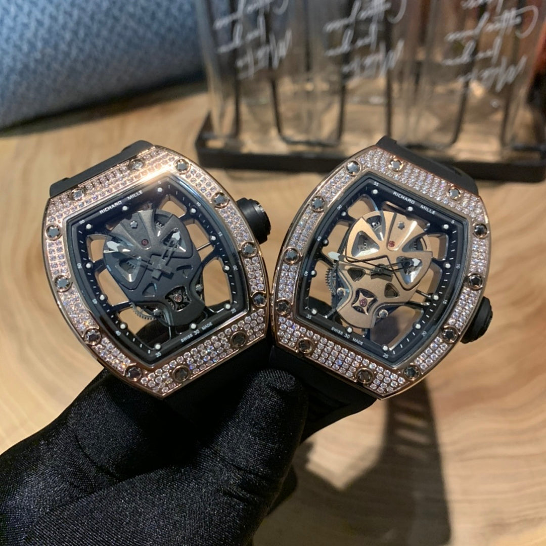 Pair of square luxury watches, black straps, diamond bezels, skeleton dials