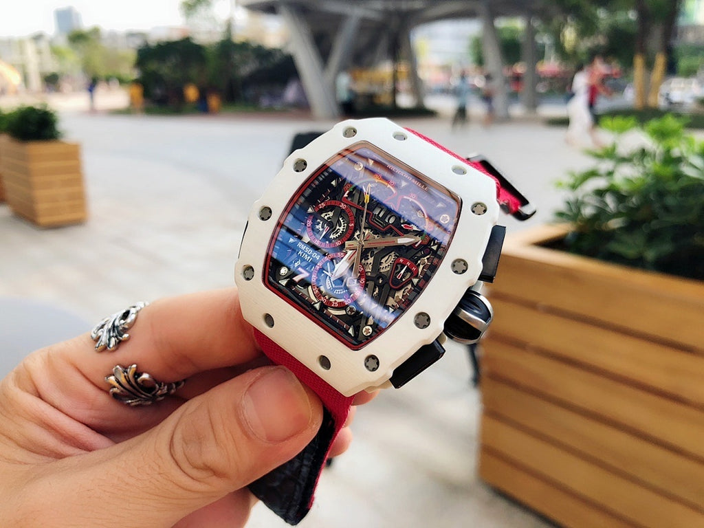 Richard Mille wristwatch close-up, light case and black skeleton dial with colorful details