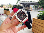 Richard Mille wristwatch angled view, red strap with light case and black skeleton dial