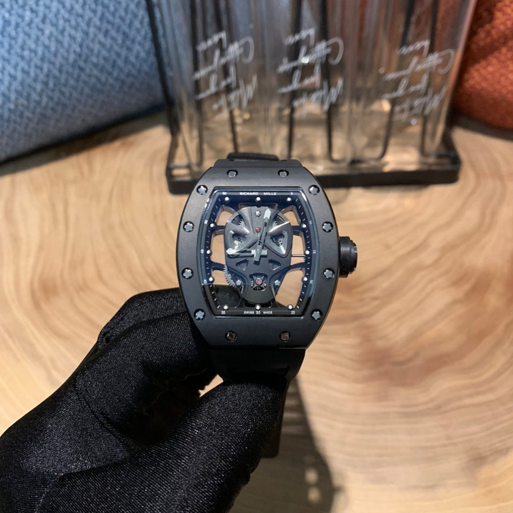 Richard Mille watch, front view with silver case, black bezel, skeleton dial