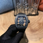 Richard Mille watch, front view with silver case, black bezel, skeleton dial