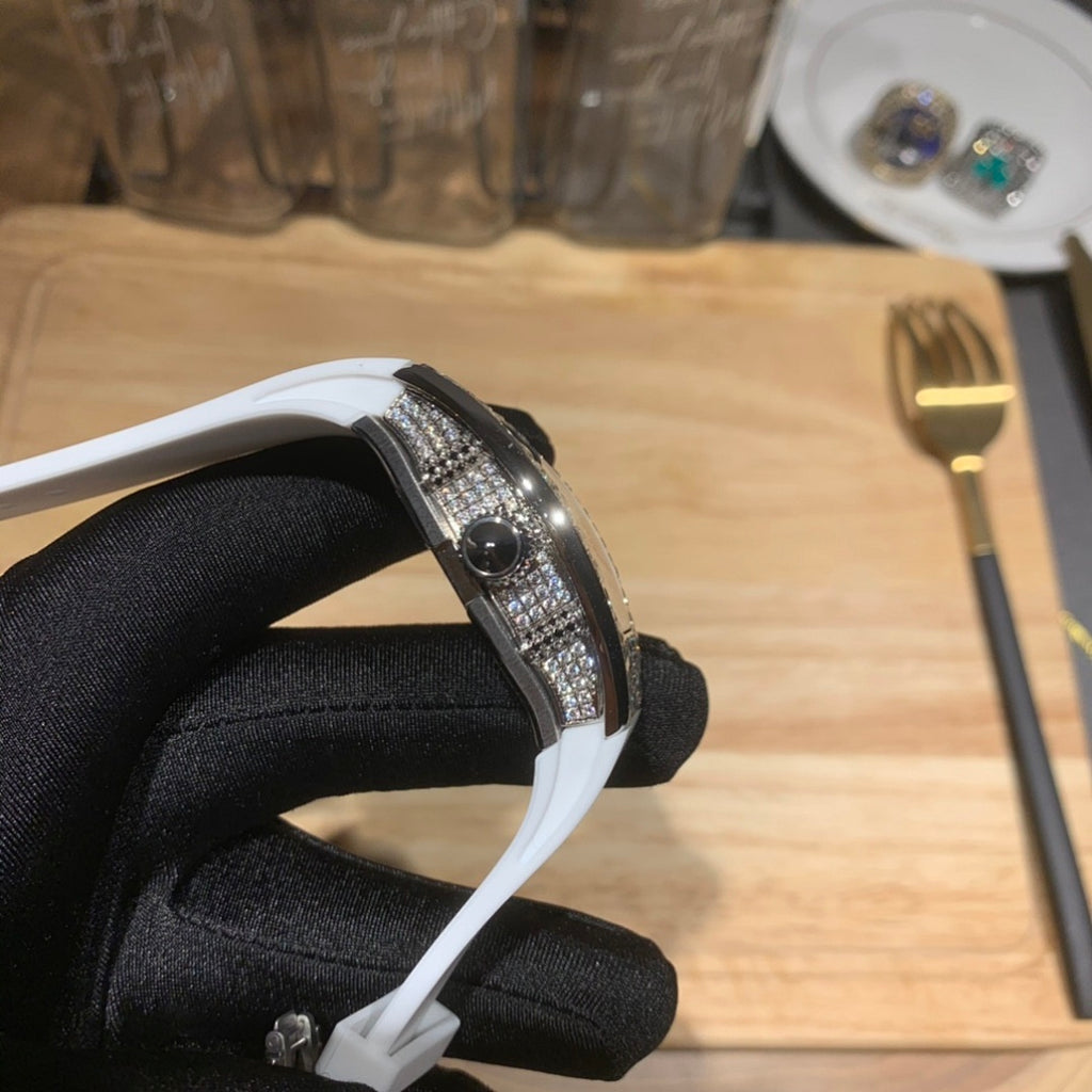 Richard Mille watch side profile, white strap with diamond bezel edge.