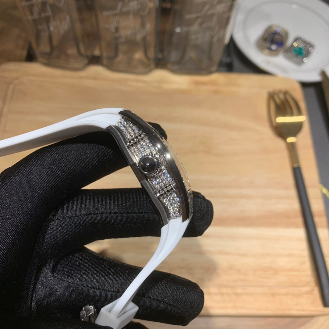 Richard Mille watch side profile, white strap with diamond bezel edge.
