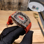 Richard Mille watch on red-orange rubber strap, three-quarter front view
