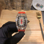 Richard Mille watch with red-orange rubber strap and jeweled silver-tone bezel