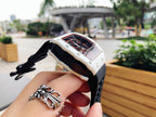 Richard Mille wristwatch side view, white case with skeleton dial, black rubber strap