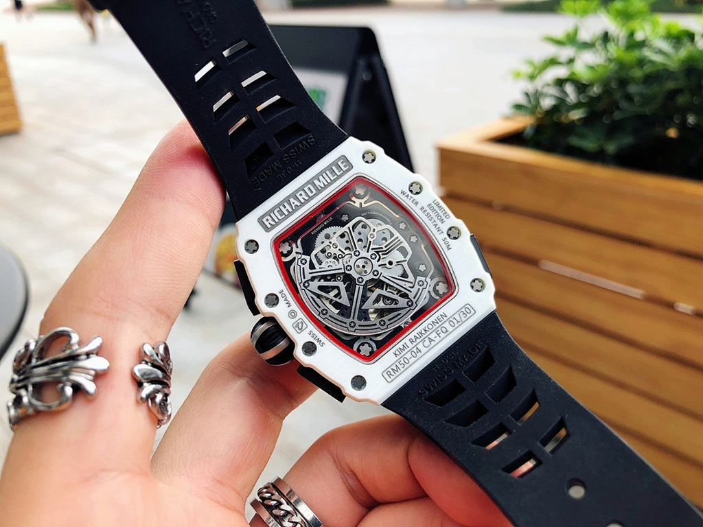 Richard Mille wristwatch back view, white case, black perforated rubber strap