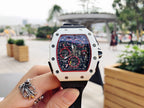 Richard Mille wristwatch with white case, black rubber strap, skeleton dial with red accents