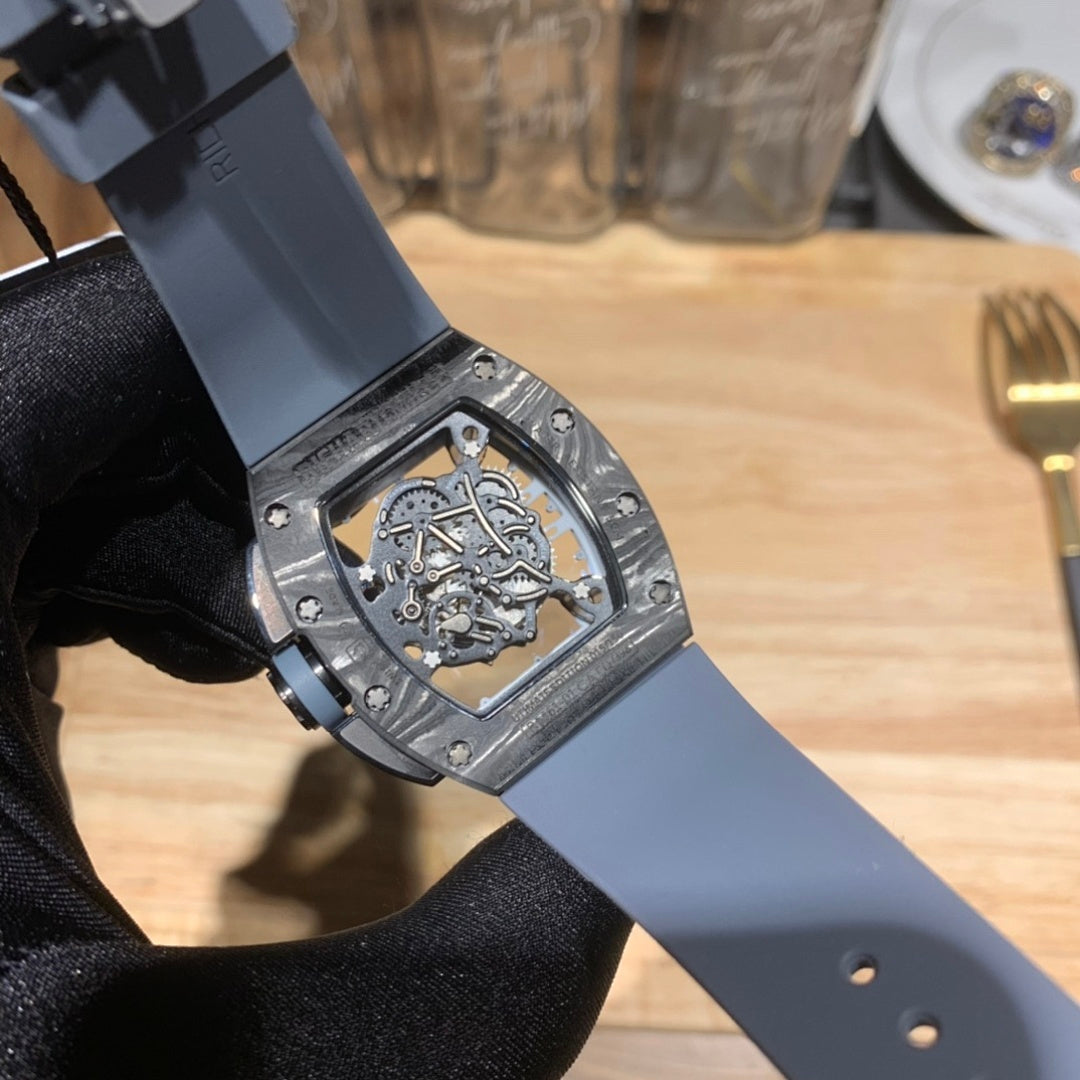 Richard Mille skeleton watch from side, light blue strap end and textured bezel
