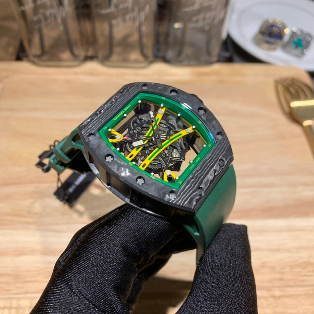 Three-quarter view square skeleton watch with green bezel, dark case, and green rubber strap