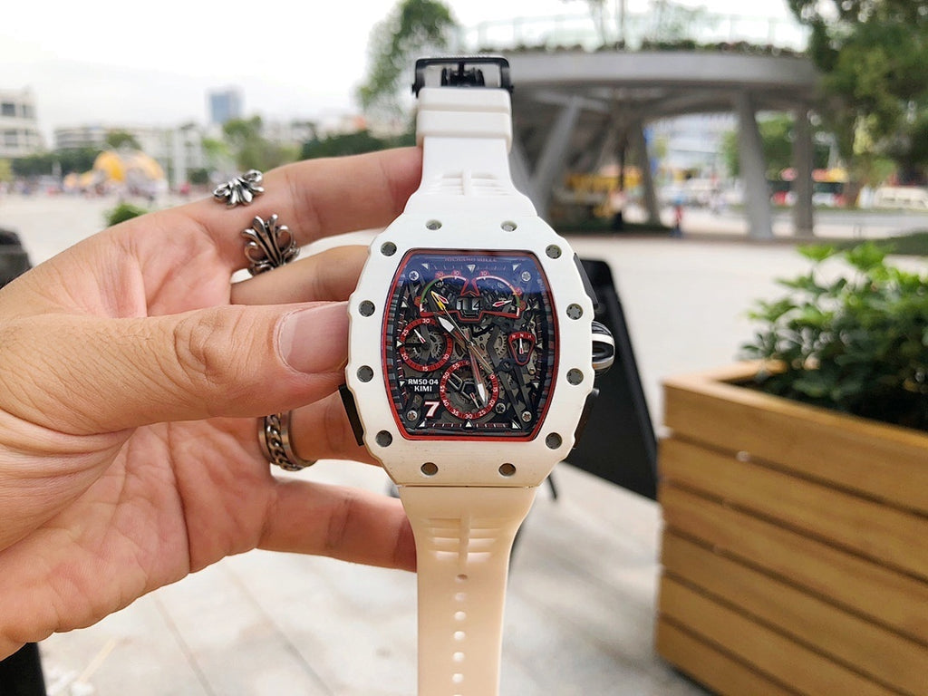 Richard Mille watch with white case and strap, openwork dial, worn on wrist