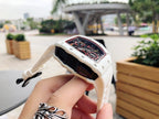Richard Mille watch back view, white case with dark panel and strap