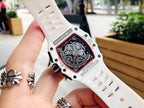 Richard Mille watch caseback close-up on white strap, engraved metal details