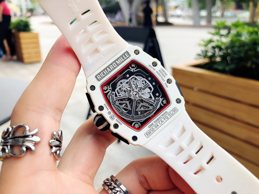 Richard Mille watch caseback close-up on white strap, engraved metal details