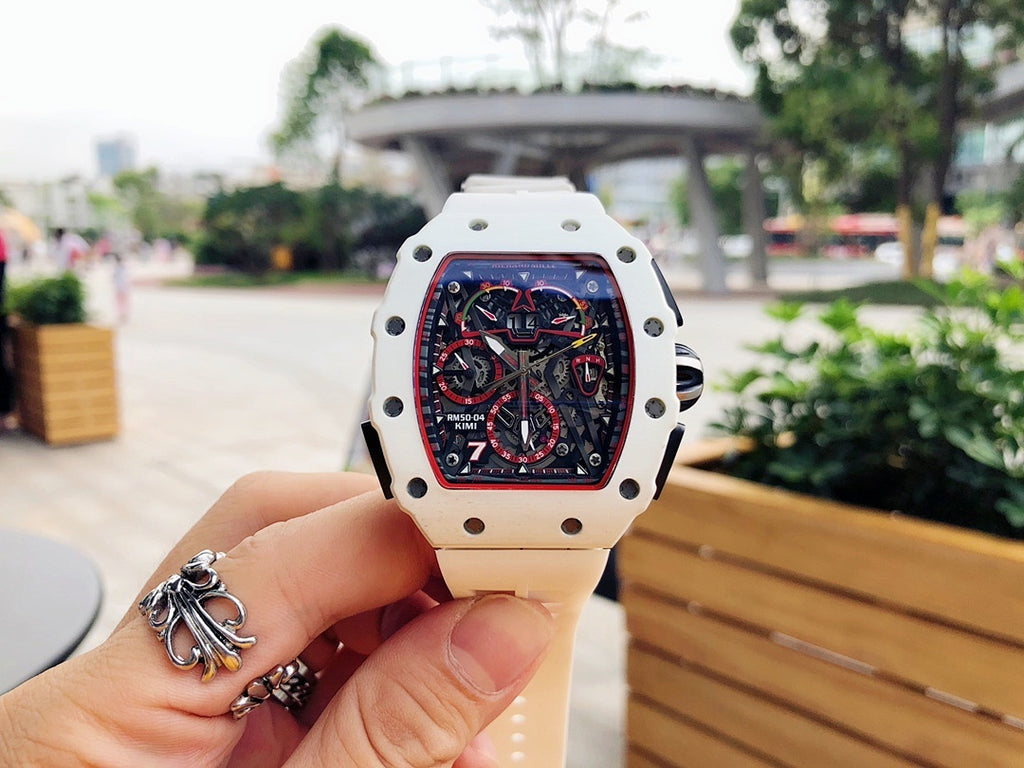 Richard Mille watch with white case and strap, square skeleton dial with red details