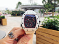 Richard Mille watch with white case and strap, square skeleton dial with red details