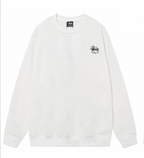 Stussy white crewneck sweatshirt with small Stussy logo on chest