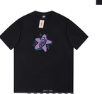 Black Stussy T-shirt with swirl graphic, blue stars, and neck tag