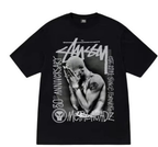 Black crewneck T-shirt with large front graphic of a face and Stussy logo