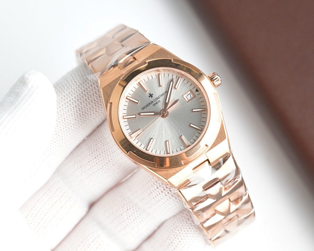 Rose gold-tone wristwatch, silver dial, metal bracelet